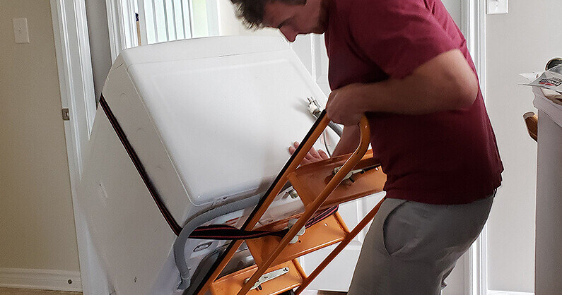 Moving an appliance with a dolley