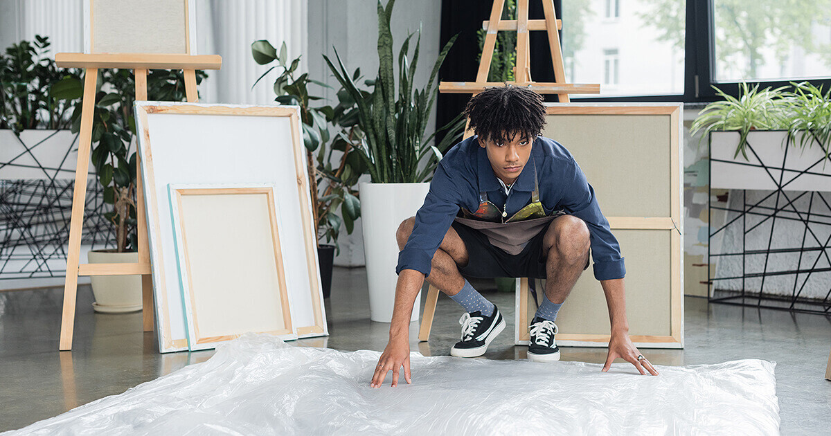 Man packing artwork for moving