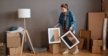 Woman packing artwork for moving house